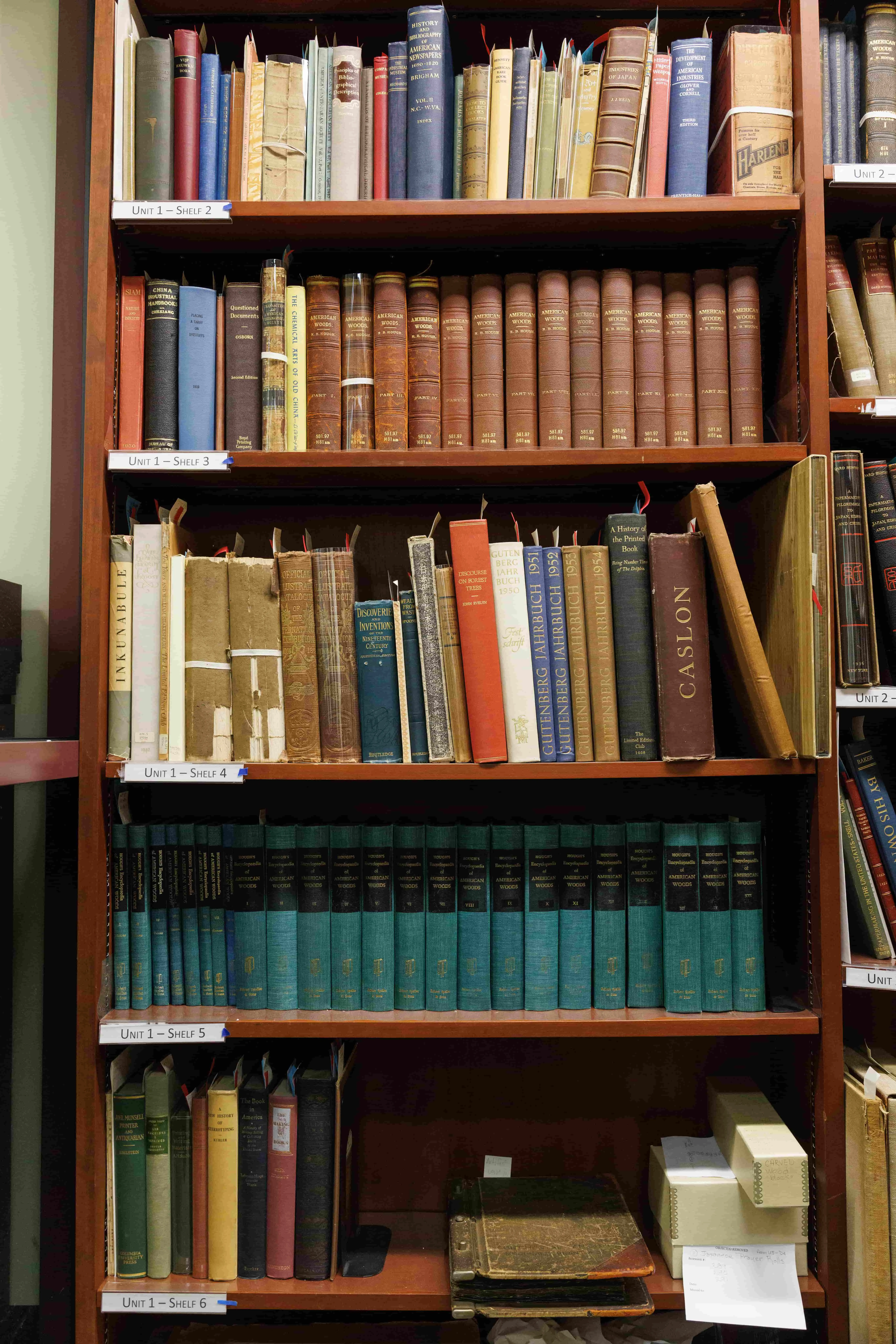 Bookshelf in Papeermaking Museum's rare book library with two sets of American Woods.